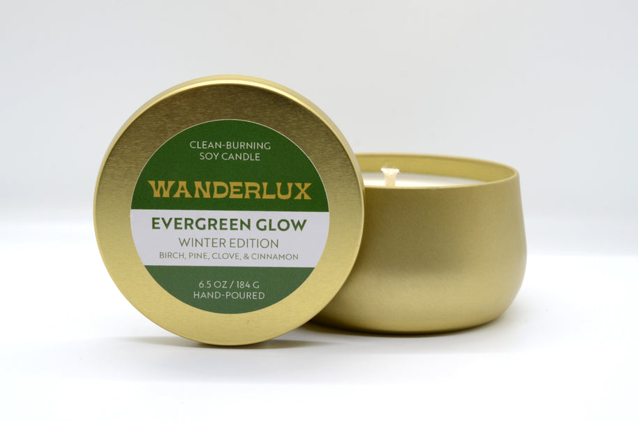 Evergreen Glow Wanderlux Candle in Brass Colored Tin 6.5 Ounce