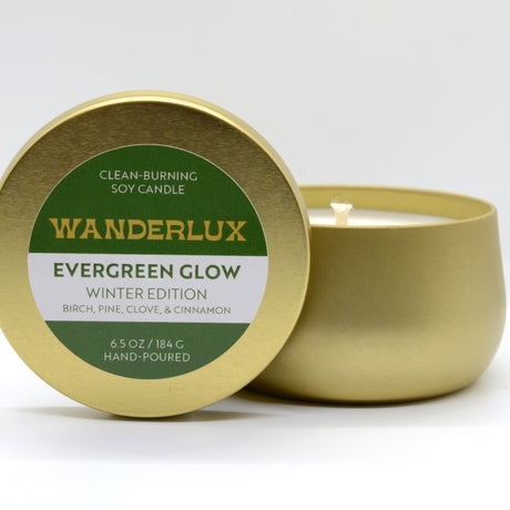 Evergreen Glow Wanderlux Candle in Brass Colored Tin 6.5 Ounce